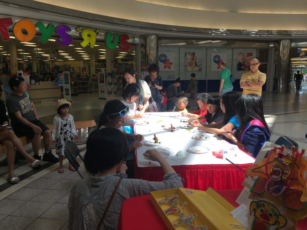 Children making rice-dough figurines 